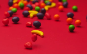 Stock Video Fruit Shaped Candies Sliding On A Surface For PC