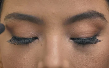 Stock Video Front Look Of A Woman While Being Made Up For PC