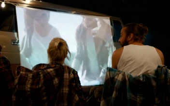 Stock Video Friends Watching A Movie At The Campsite For PC