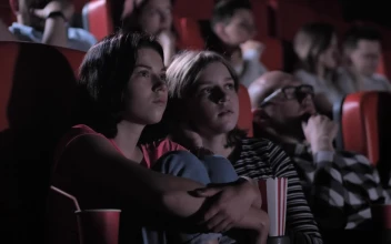 Stock Video Friends Watching A Horror Film In The Cinema For PC