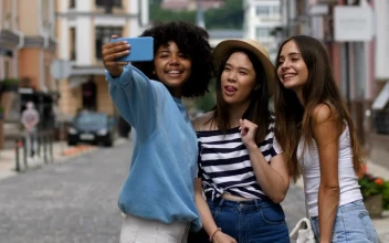 Stock Video Friends Taking Selfies In The Middle Of A Street For PC