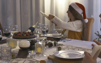 Stock Video Friends Sitting At A Table Setting For Christmas Dinner For PC