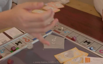 Stock Video Friends Playing Monopoly For PC
