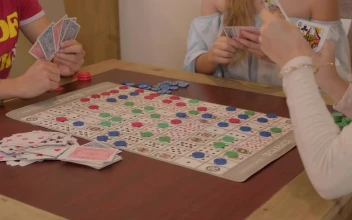 Stock Video Friends Playing A Game Of Sequence For PC