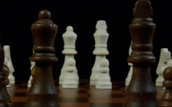 Stock Video King And Queen Across A Chessboard Animated Wallpaper