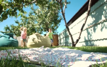 Stock Video Kids Watching Tablet In The Garden Animated Wallpaper