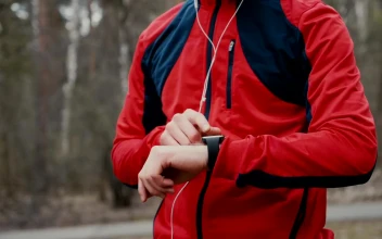 Stock Video Jogger Checks Heart Rate On Smartwatch In Forest Animated Wallpaper