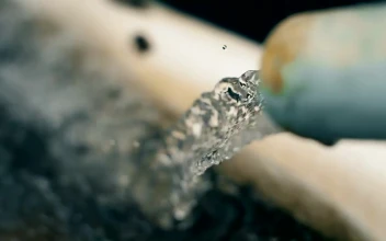 Stock Video Jet Water Is Poured Into The Hands Of A Person Animated Wallpaper