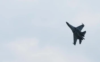 Stock Video Jet Military Aircraft Crosses The Sky Animated Wallpaper