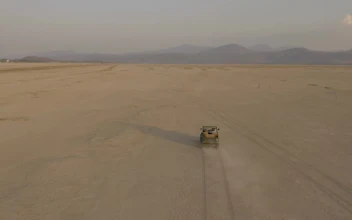 Stock Video Jeep Truck Traveling Through A Desert Seen From The Air Animated Wallpaper