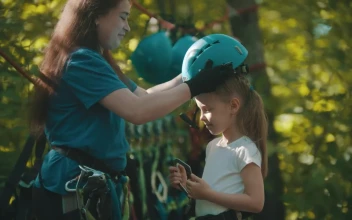 Stock Video Instructor Putting A Protective Helmet On A Little Girl Animated Wallpaper