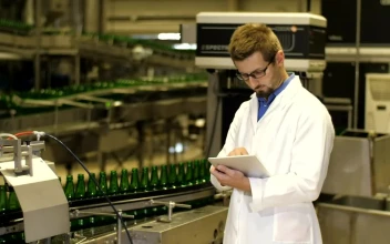 Stock Video Inspector Checking Production Of Beer Bottles Animated Wallpaper