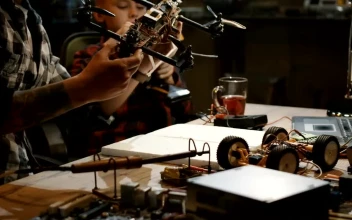 Stock Video Inspecting A Drone In A Workshop Animated Wallpaper