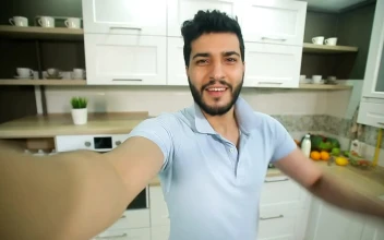 Stock Video Influencer Waves Hello To Subscribers On Webcam Animated Wallpaper