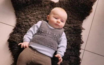 Stock Video Infant Laying On A Rug Animated Wallpaper