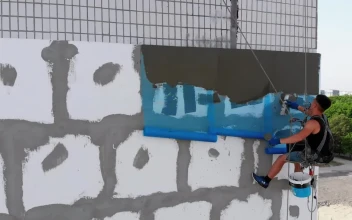 Stock Video Industrial Climber Putting Cement To A Wall Animated Wallpaper