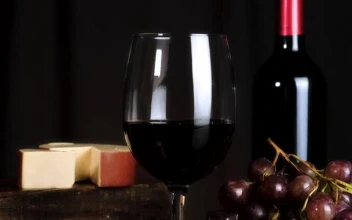 Stock Video Image Composition On A Table With Wine Cheese Grapes And Animated Wallpaper