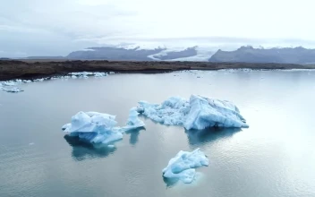 Stock Video Iceberg Floating In The Ocean Near The Coast Animated Wallpaper