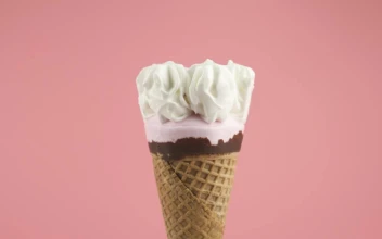 Stock Video Ice Cream Cone With Syrup On A Pink Background Animated Wallpaper