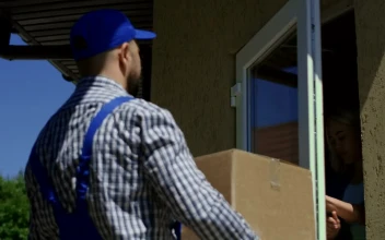 Stock Video I Woman Receives A Box From The Delivery Guy Animated Wallpaper