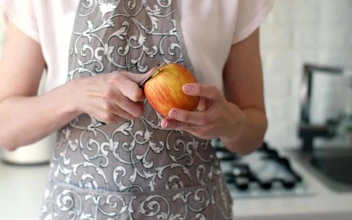 Stock Video Housewife Peeling An Apple With A Knife Animated Wallpaper