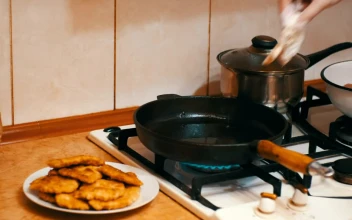 Stock Video Housewife Frying Meat In A Frying Pan Animated Wallpaper
