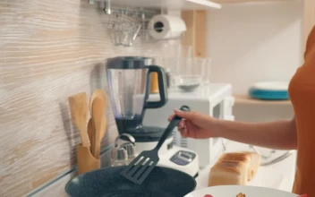 Stock Video Housewife Cooking Breakfast In The Kitchen Animated Wallpaper