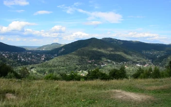Stock Video Houses Between Mountains Animated Wallpaper