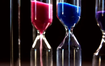 Stock Video Hourglasses On Black Background Close Up Animated Wallpaper
