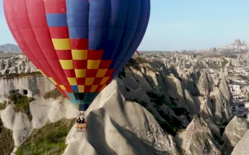 Stock Video Hot Air Balloon Floats Over Turkish Landscape Animated Wallpaper