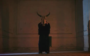 Stock Video Hooded Person In Old Room With Bull Skull Animated Wallpaper