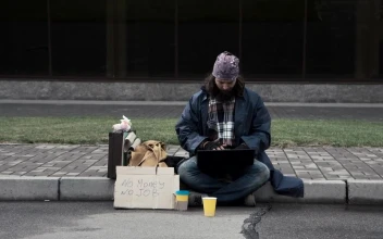 Stock Video Homeless Man With A Laptop Sitting On The Sidewalk Animated Wallpaper