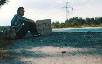 Stock Video Hitchhiker With A Cardboard Sign Animated Wallpaper