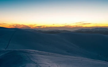 Stock Video Hill Covered With Snow During A Sunrise Animated Wallpaper