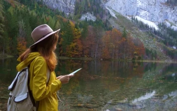 Stock Video Hiking Woman Looking At Map At The Lake Shore Animated Wallpaper