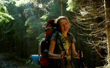Stock Video Hiker Woman With Big Backpack In The Forest Animated Wallpaper