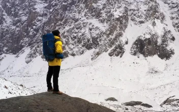 Stock Video Hiker With A Backpack Watching The Winter Mountains Animated Wallpaper