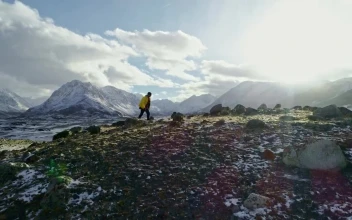 Stock Video Hiker Walking On A Hilly Landscape Animated Wallpaper