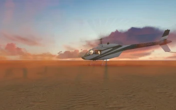 Stock Video Helicopter Taking Off From The Desert Animated Wallpaper