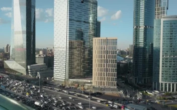 Stock Video Heavy Traffic Heading By Skyscrapers Animated Wallpaper