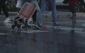 Stock Video Heavy Rain As People Walk Across Town Animated Wallpaper