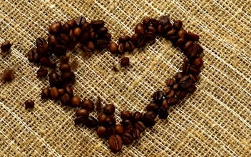 Stock Video Heart Of Coffee Filled With Coffee Beans On A Sack Animated Wallpaper