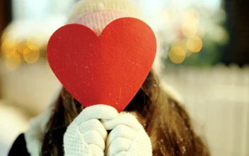 Stock Video Heart Cutout Reveals Smiling Young Woman In Winter Scene Animated Wallpaper