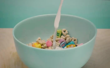 Stock Video Healthy Cereal In A Bowl While Pouring Milk Animated Wallpaper