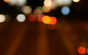Stock Video Headlights Out Of Focus Against The Night Animated Wallpaper