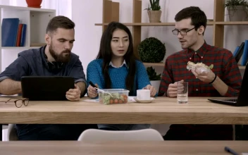 Stock Video Having A Working Lunch In The Office Animated Wallpaper