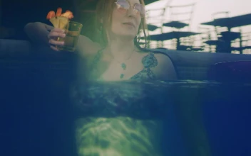 Stock Video Happy Young Woman Enjoying A Cocktail In The Pool Animated Wallpaper