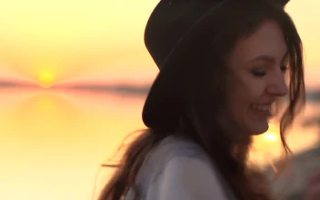 Stock Video Happy Woman With Sparklers At Sunset Animated Wallpaper