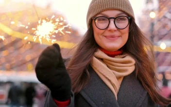 Stock Video Happy Woman With Sparklers At A Christmas Park Animated Wallpaper