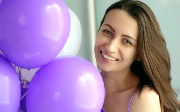Stock Video Happy Woman With Purple And White Balloons Portrait Animated Wallpaper